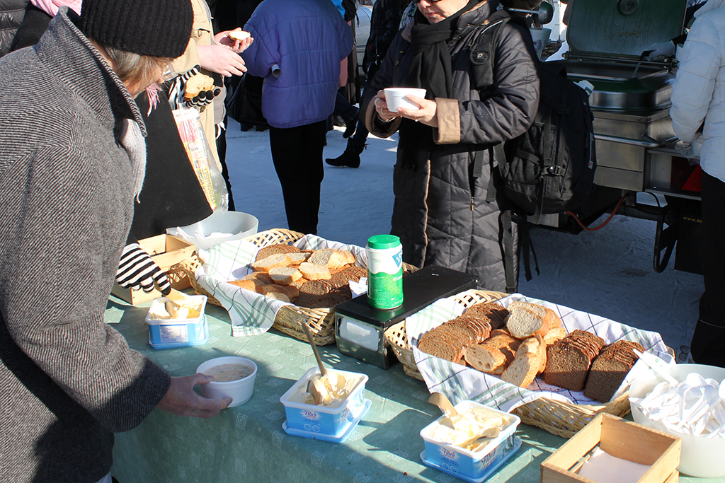 A table with food, bread and butter.