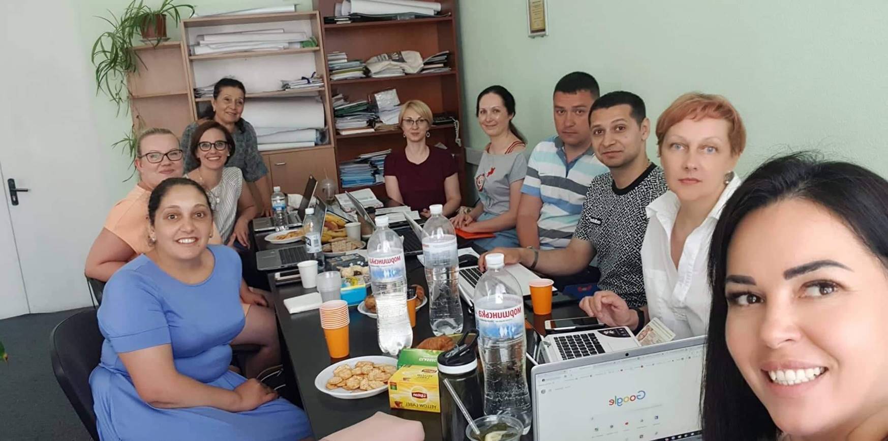 A group of people around the conference table.