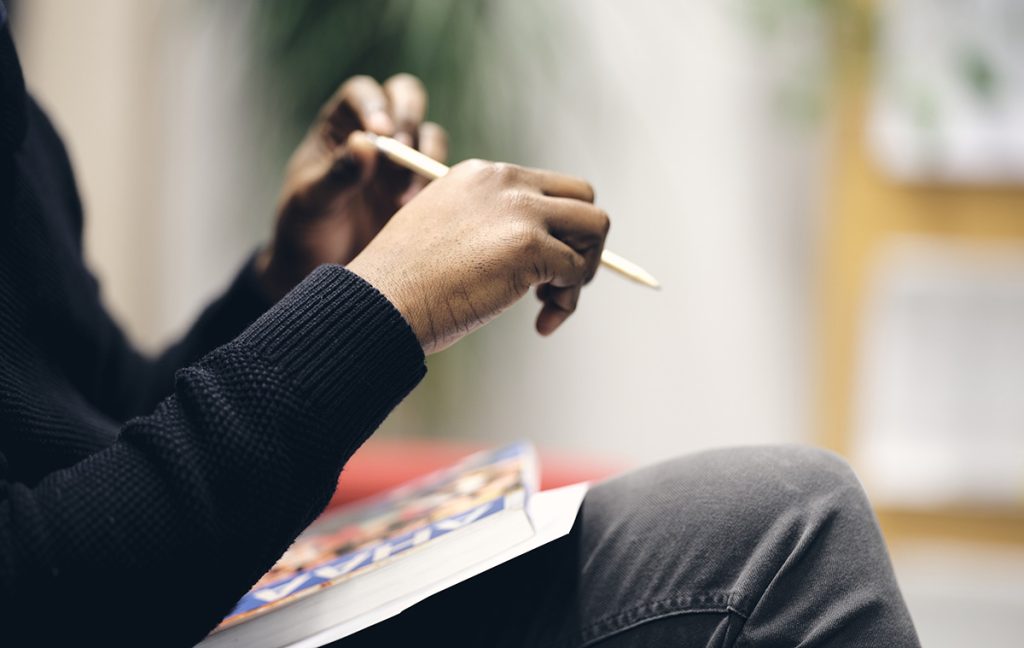 A man holding a pen.