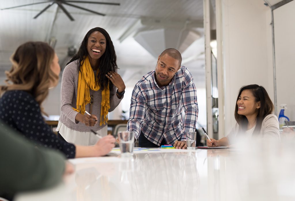 Four people working together